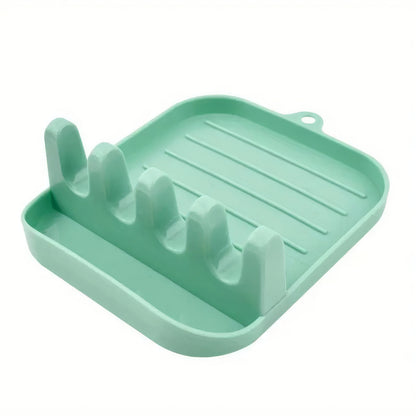 Green Cutlery Rack for Organized Kitchen Storage.
