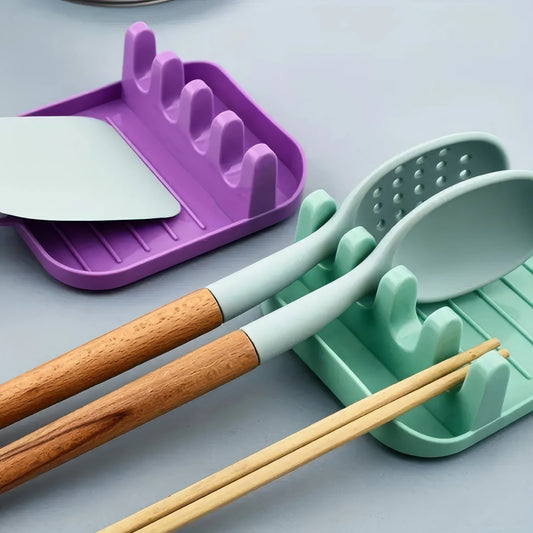 Green Cutlery Rack for Organized Kitchen Storage.
