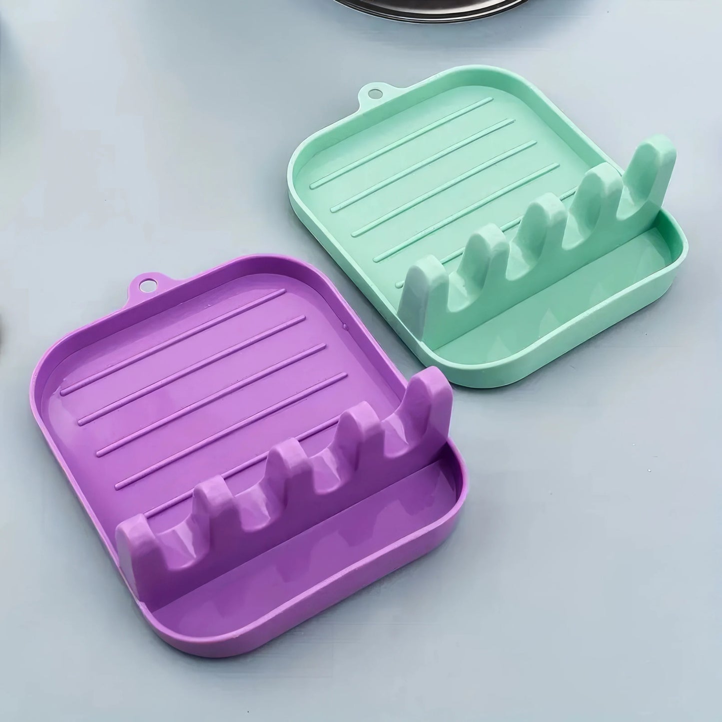 Green Cutlery Rack for Organized Kitchen Storage.